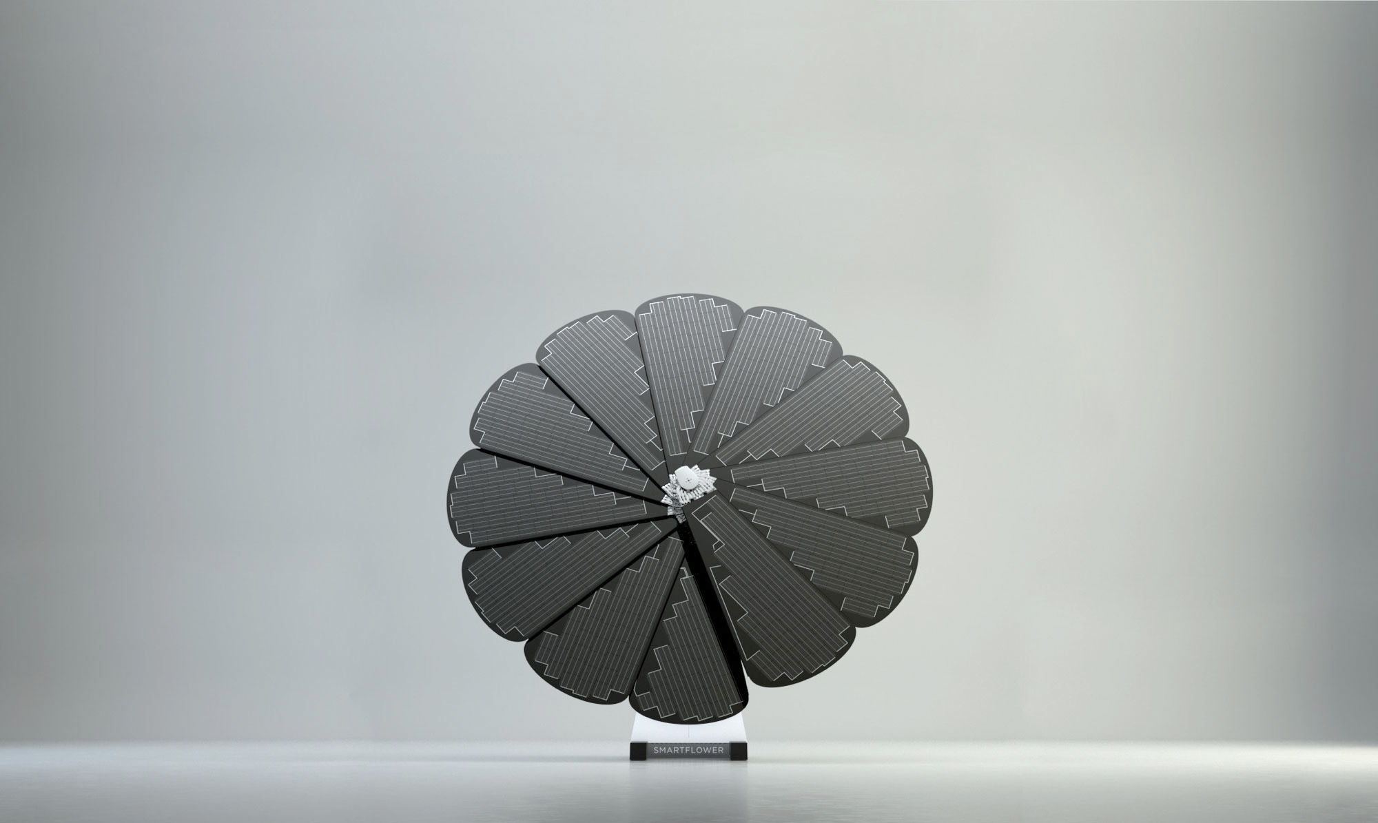 Single SmartFlower Stands Against a Grey Background in an Open Studio