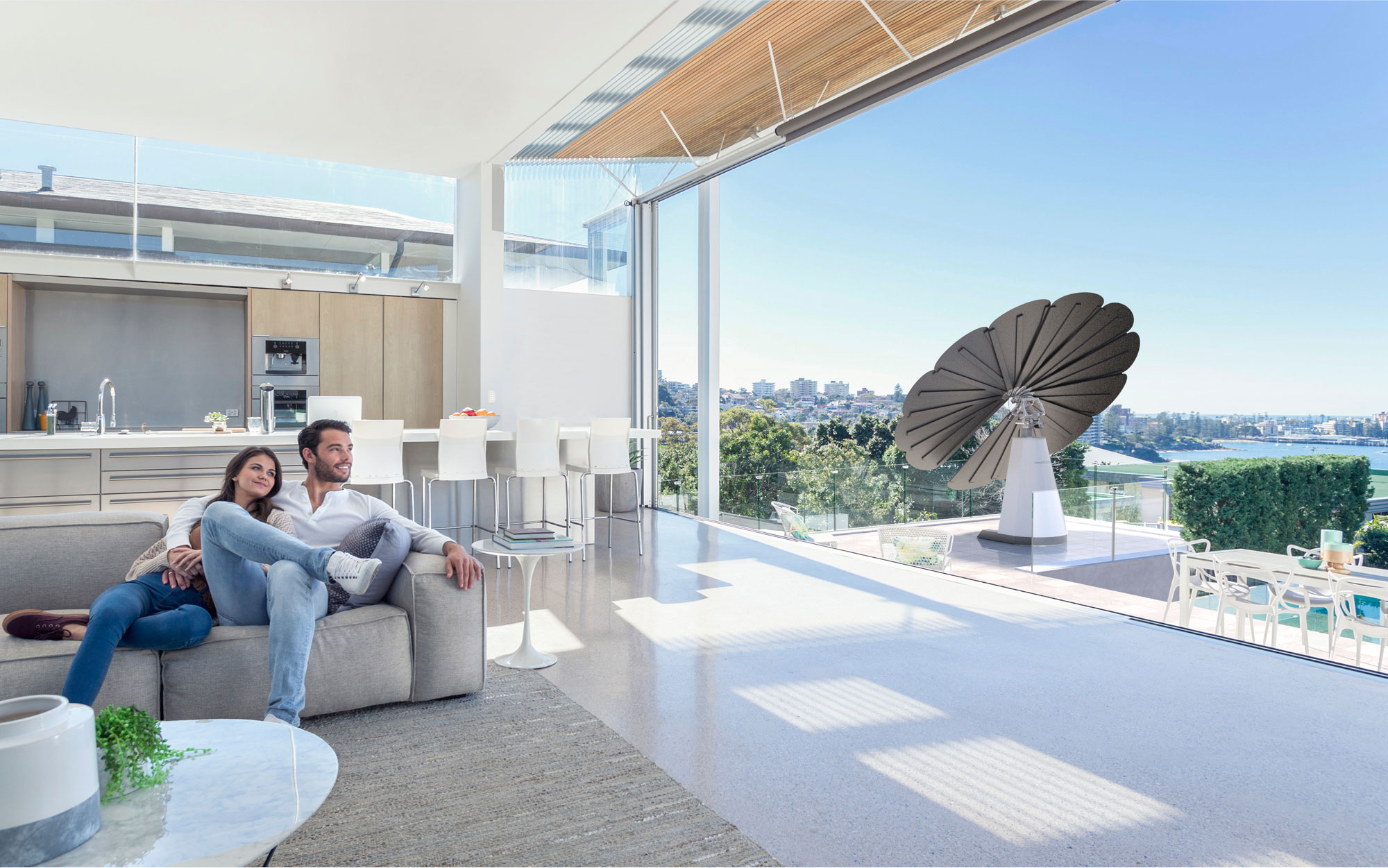 Young Couple Enjoys Their SmartFlower Solar Panel on the Balcony of Their Apartment